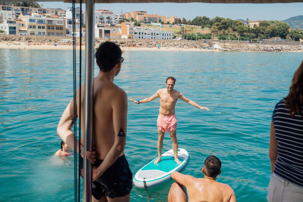 A small group in conversation aboard the GrowBoat catamaran