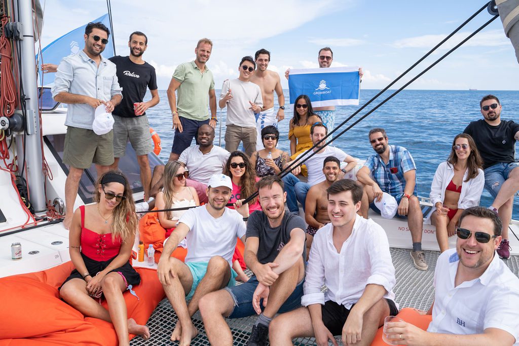 GrowBoat guests on the bow of the catamaran at sea