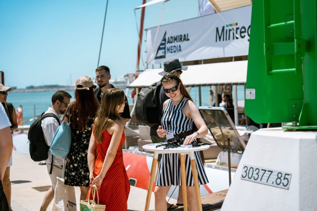 Guests sharing insights and conversations on a sunny day aboard the GrowBoat yacht