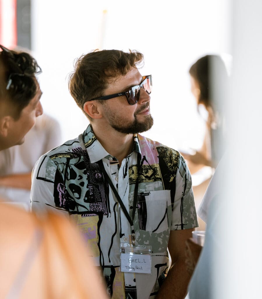 Candid moment of GrowBoat guests laughing and networking aboard the yacht