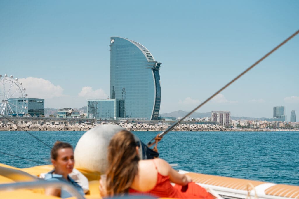 Two guests deep in conversation aboard the GrowBoat sailing yacht