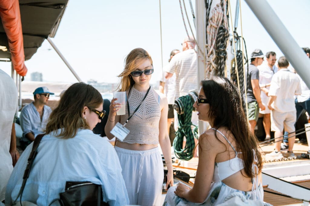 GrowBoat Barcelona attendee enjoying the breeze on the yacht bow