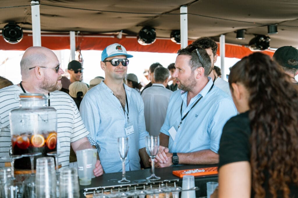 Group of industry leaders sharing a moment on the GrowBoat sailing experience