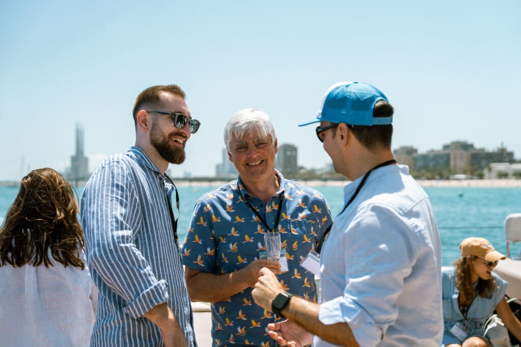 Guest capturing memories with a photo aboard the GrowBoat sailing yacht