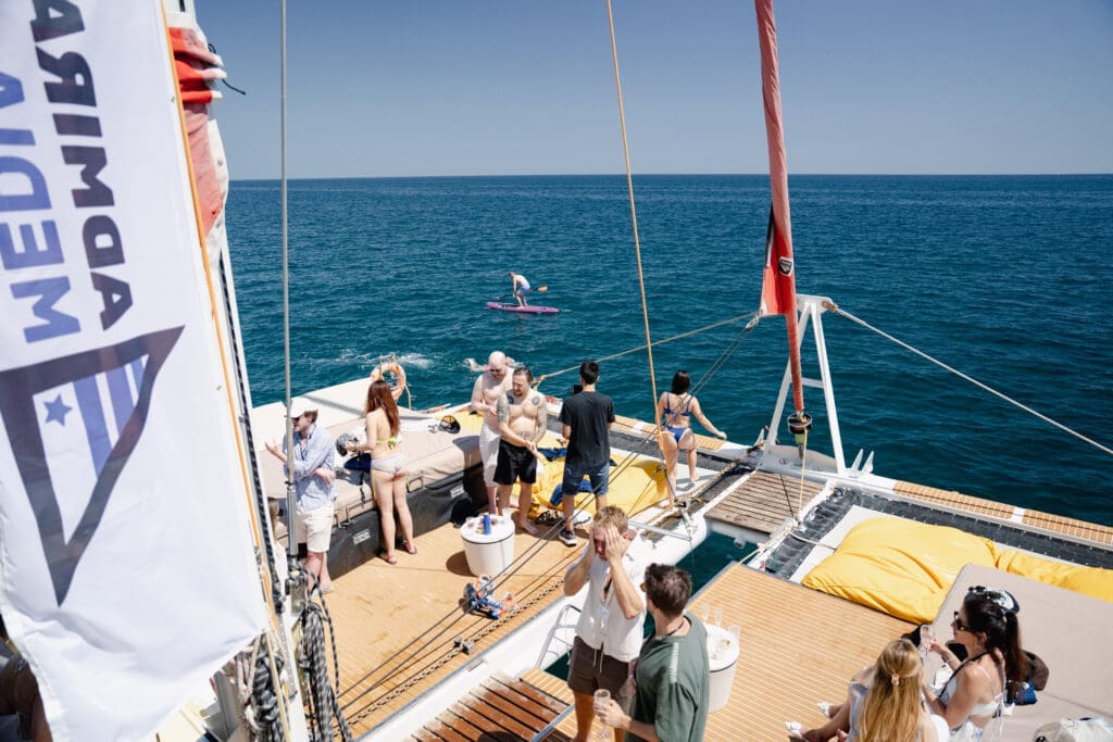 Attendees enjoying the warmth and camaraderie aboard the GrowBoat sailing yacht