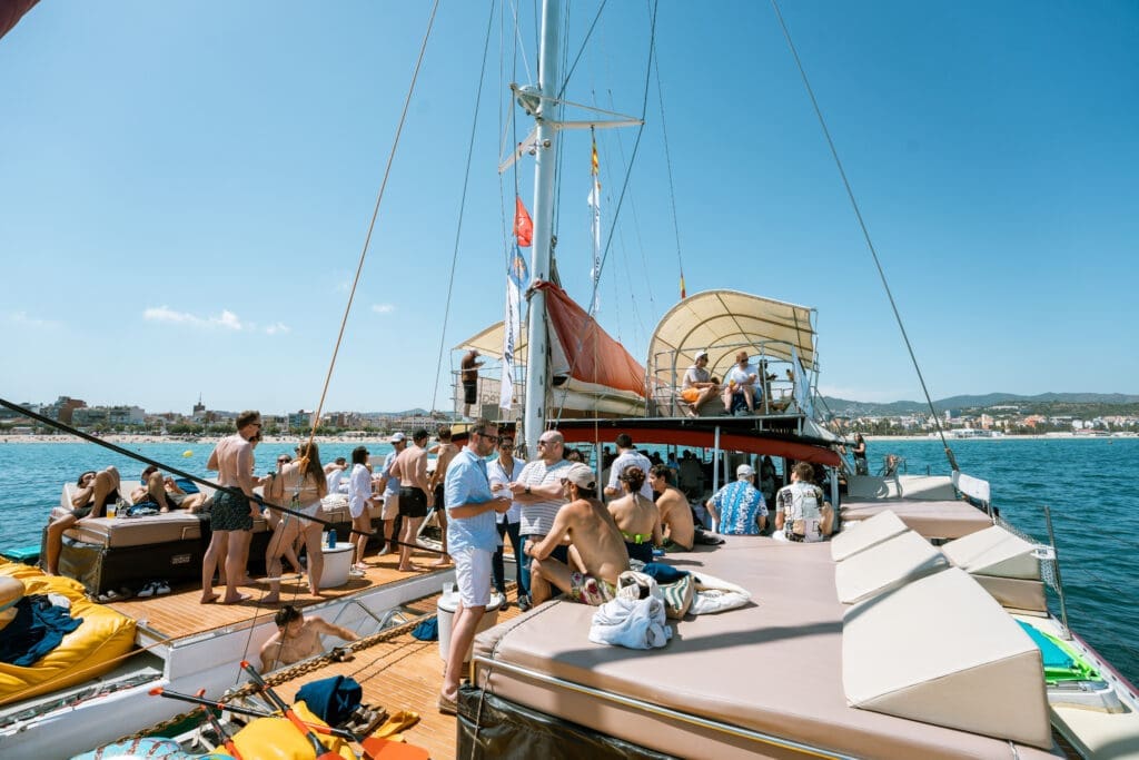 GrowBoat Barcelona guests embracing the adventure of sailing the Mediterranean