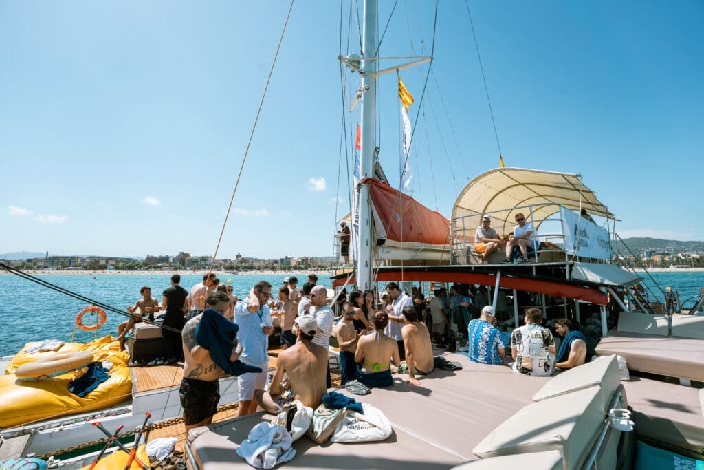 Portrait of attendees against the sparkling Mediterranean waters during GrowBoat