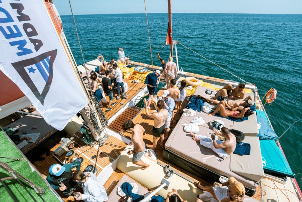 Overhead view of GrowBoat guests enjoying the yacht deck in Barcelona