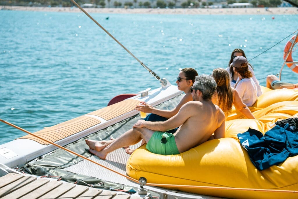 GrowBoat Barcelona guests taking a refreshing dip in the Mediterranean