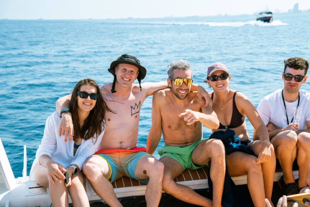 GrowBoat Barcelona event attendees with the city skyline behind them