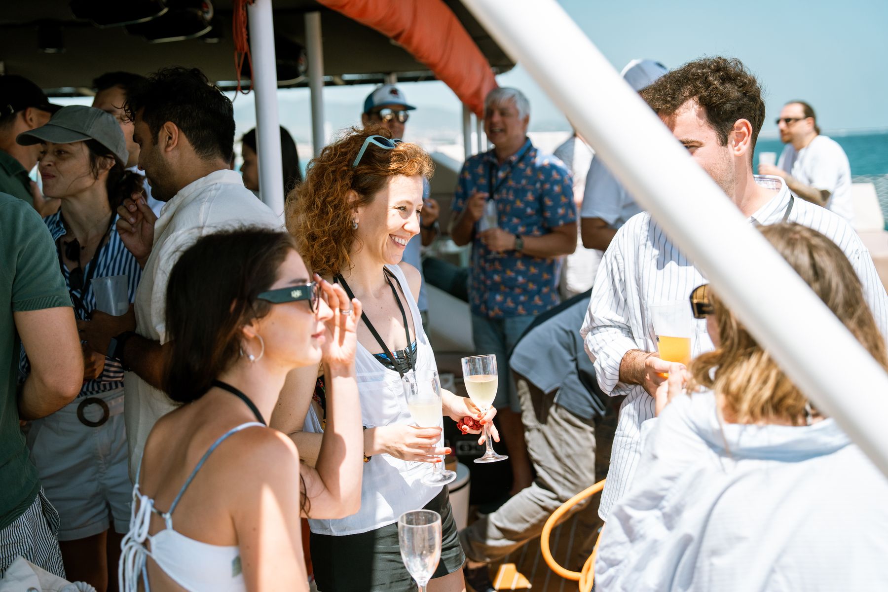 Guests on deck against the blue Mediterranean off Barcelona