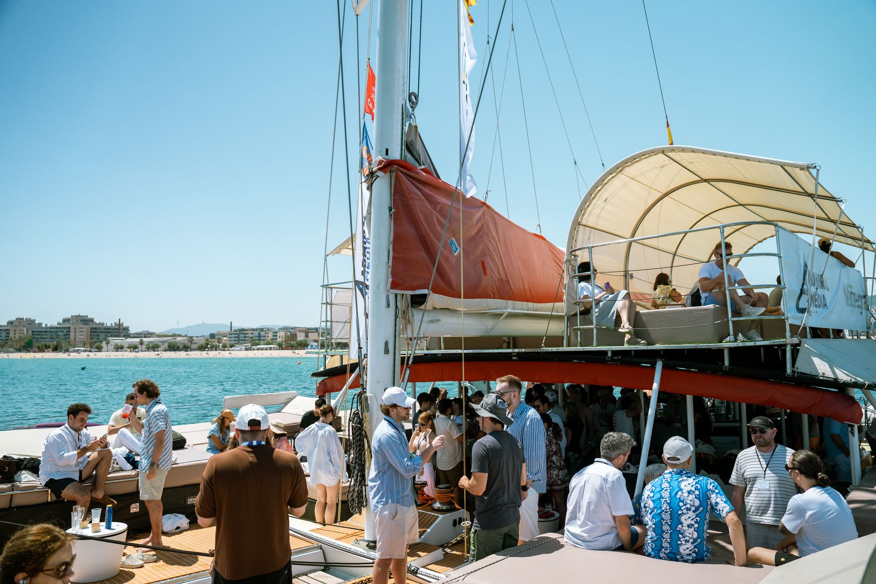 A small group in conversation on the GrowBoat catamaran