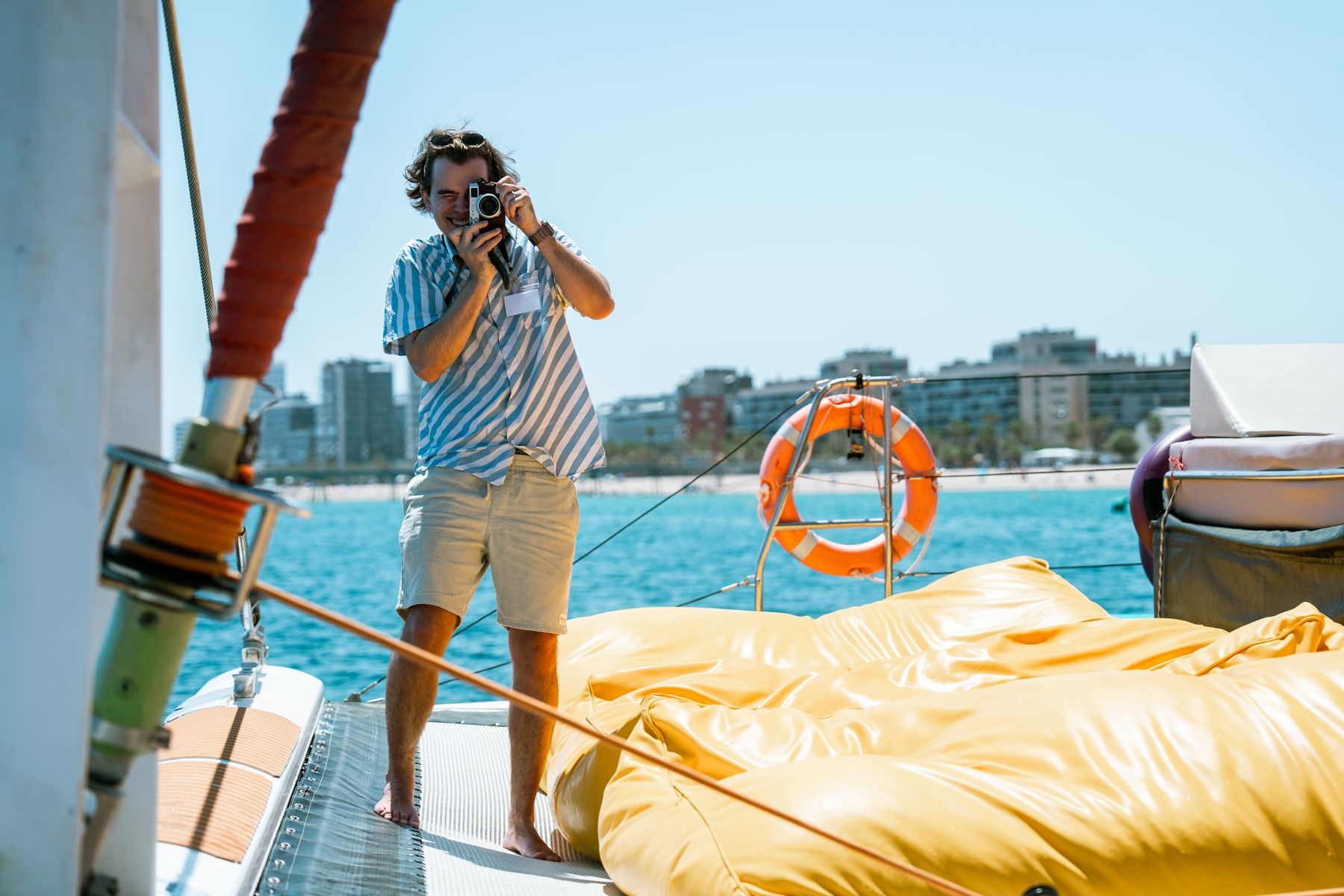 Guests on deck against the blue Mediterranean off Barcelona