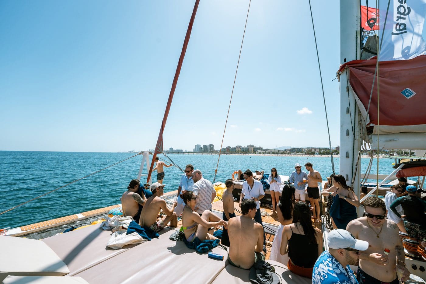 A group of growth leaders gathered on the GrowBoat catamaran deck under the Mediterranean sun